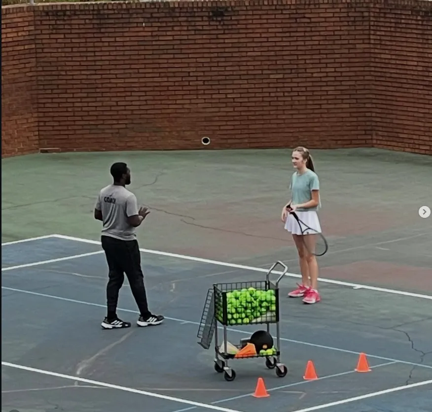 Coach Dingle running a drill with a junior player