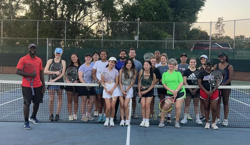 Welcome to J15 Tennis Academy — group on the court at Newman Tennis Center